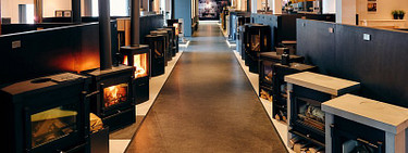 Wat is het verschil tussen kachels van plaatstaal, gietijzer en speksteen?